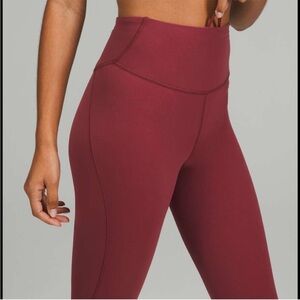 Lululemon NWOT Base Pace tight. Size 6. Mull Wine Color!